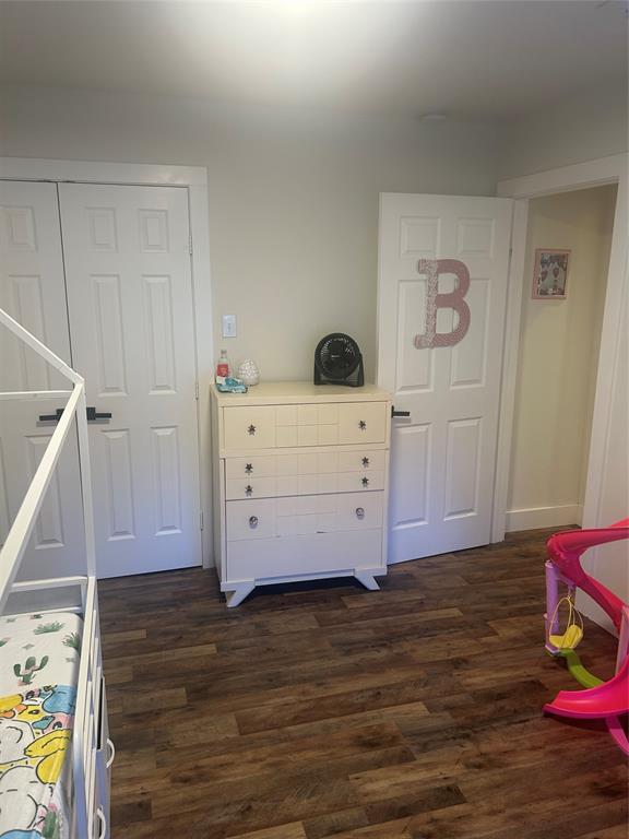 2631 Fish Tank Road Corsicana, TX 75110 - Photo 31 of 40 a view of a bedroom with wooden floor and cabinet