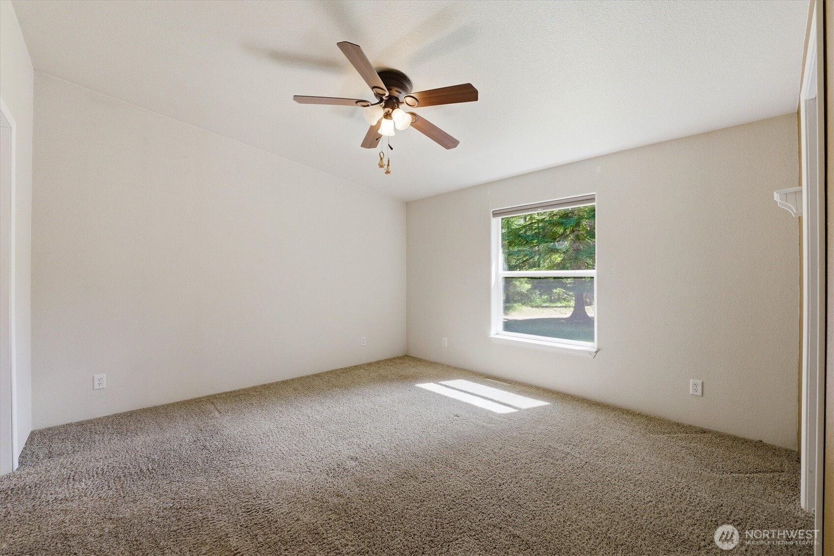 1142 Driskill Road Newport, WA 99156 - Photo 13 of 40 a view of a livingroom with a ceiling fan and window