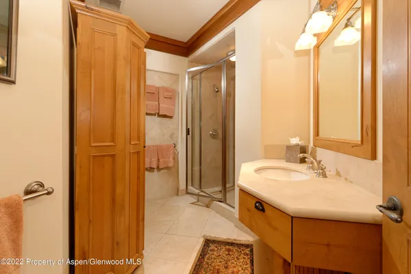 a spacious bathroom with a shower and a sink