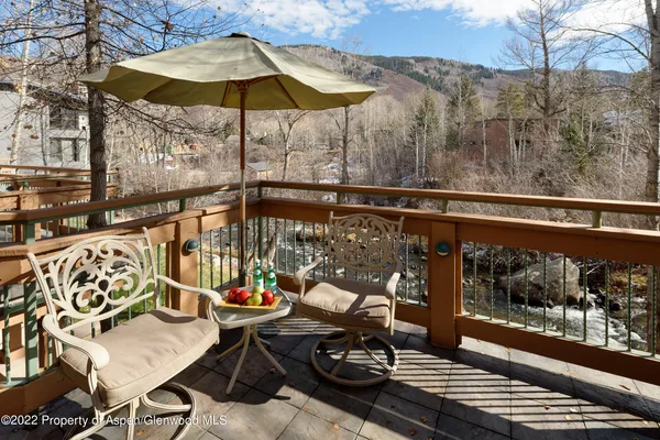 a view of balcony with wooden floor