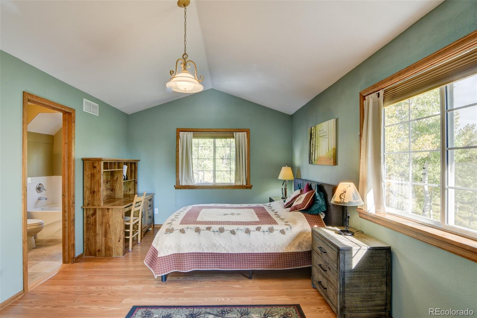 821 Blacksmith Road Hartsel, CO 80449 - Photo 31 of 50 a bedroom with a bed and a window