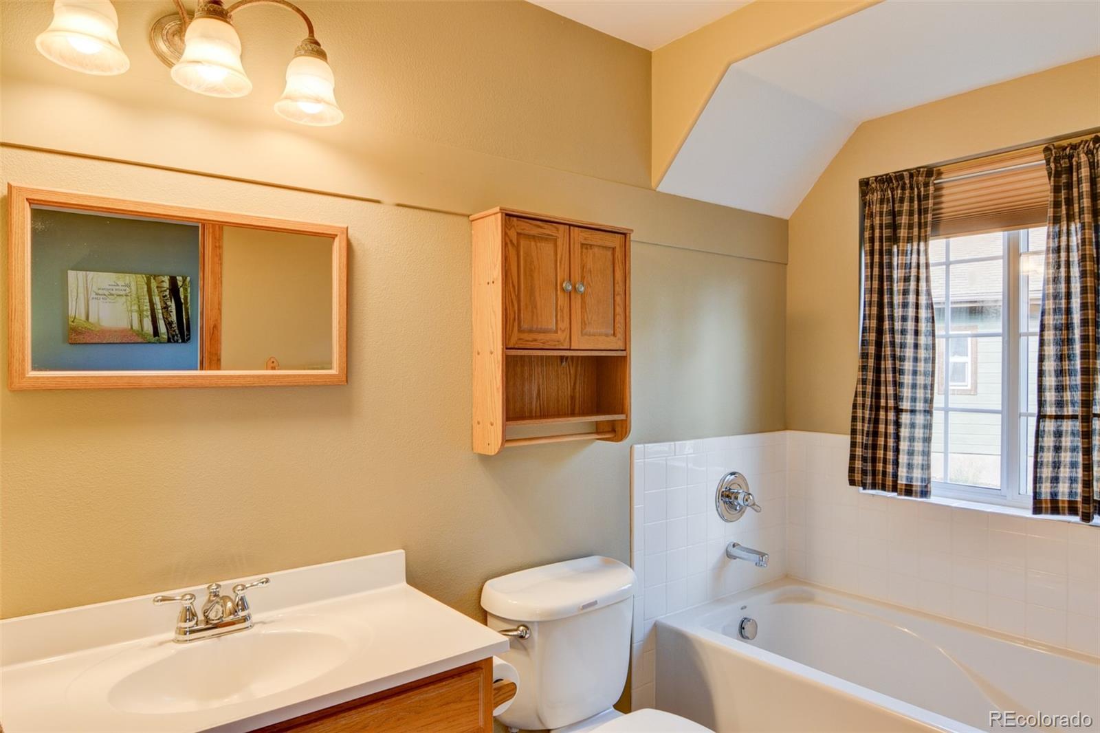 821 Blacksmith Road Hartsel, CO 80449 - Photo 34 of 50 a bathroom with a sink and a bathtub