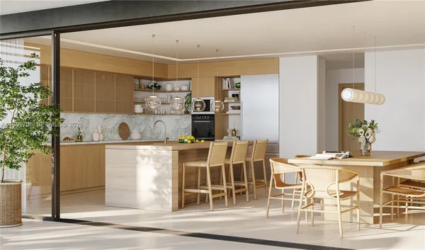 a kitchen with a table and chairs