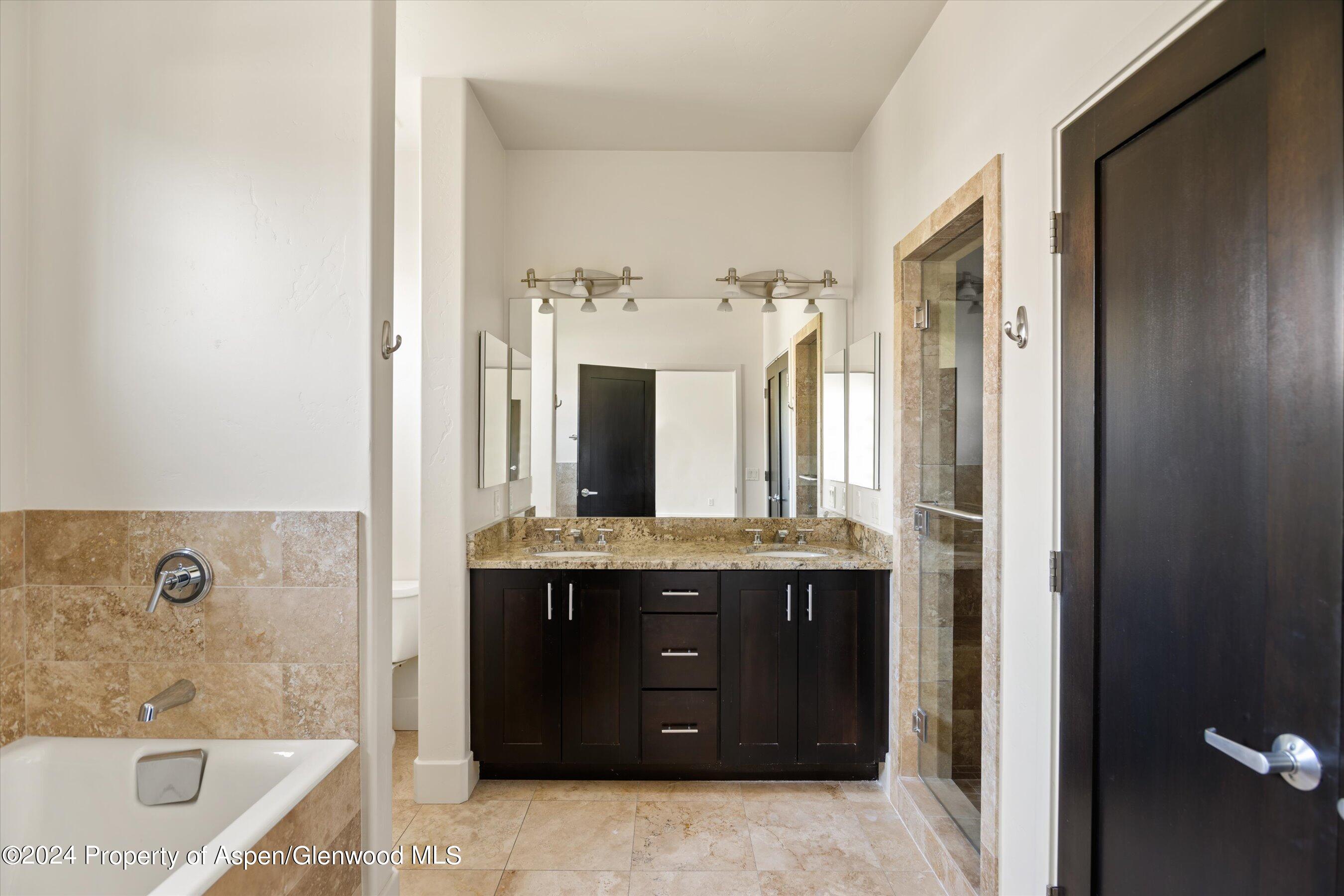 450 Jody Road Basalt, CO 81621 - Photo 13 of 22 a bathroom with a tub sink and mirror