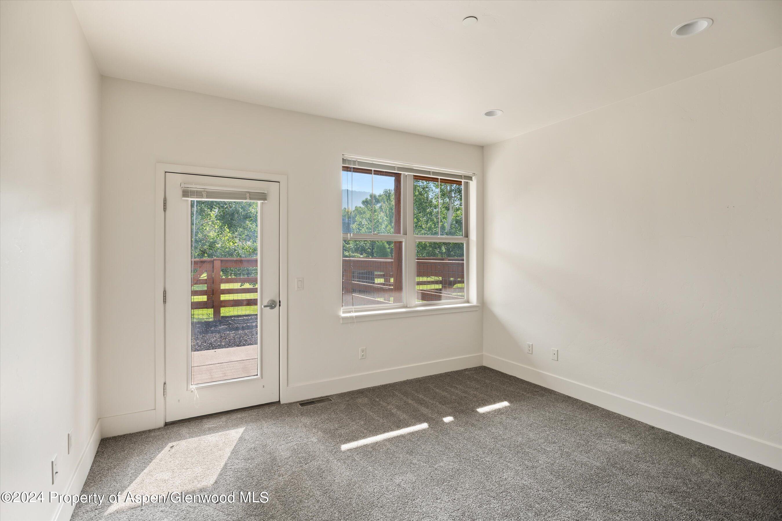 450 Jody Road Basalt, CO 81621 - Photo 14 of 22 an empty room with windows