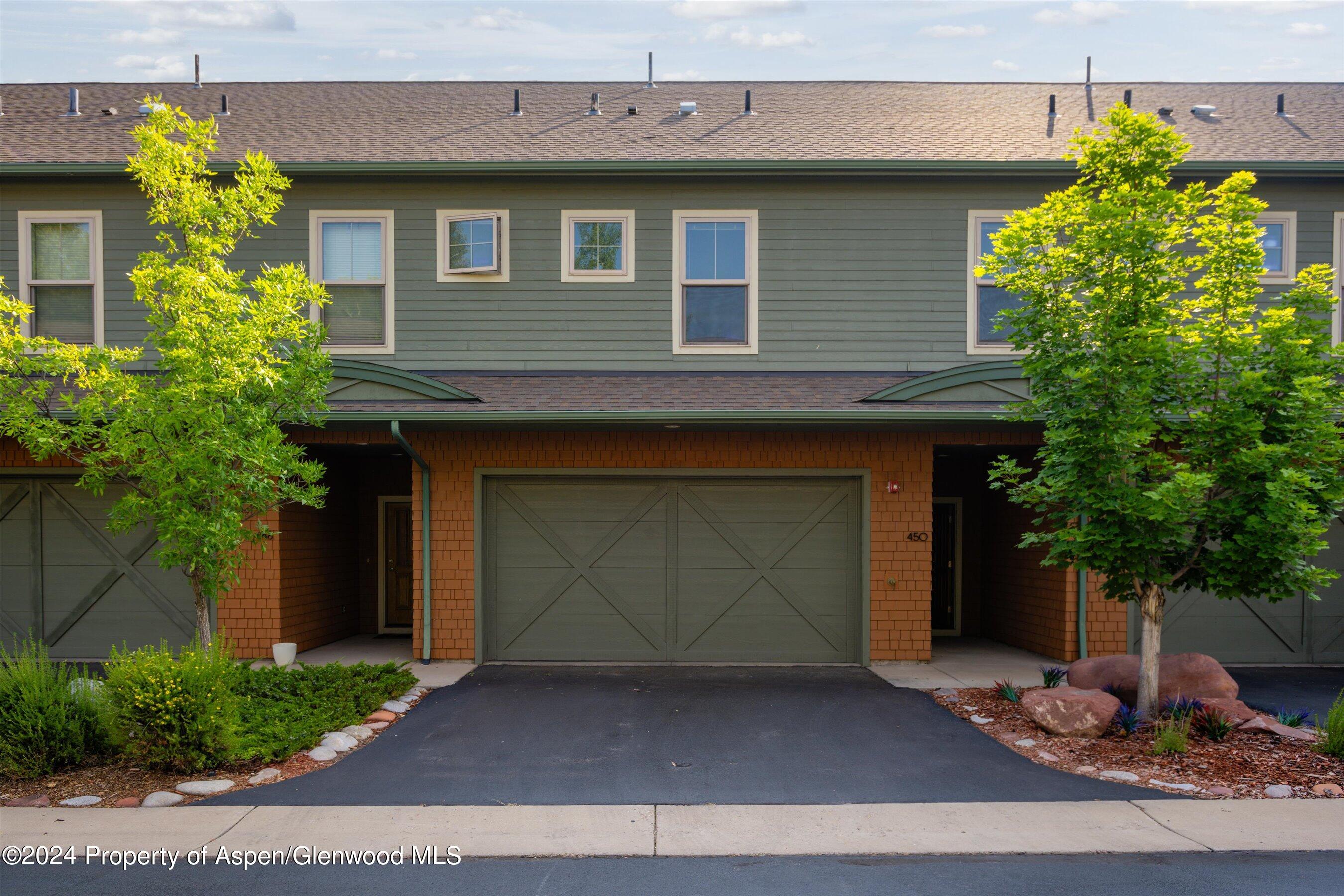450 Jody Road Basalt, CO 81621 - Photo 21 of 22 a front view of a house with a yard and garage