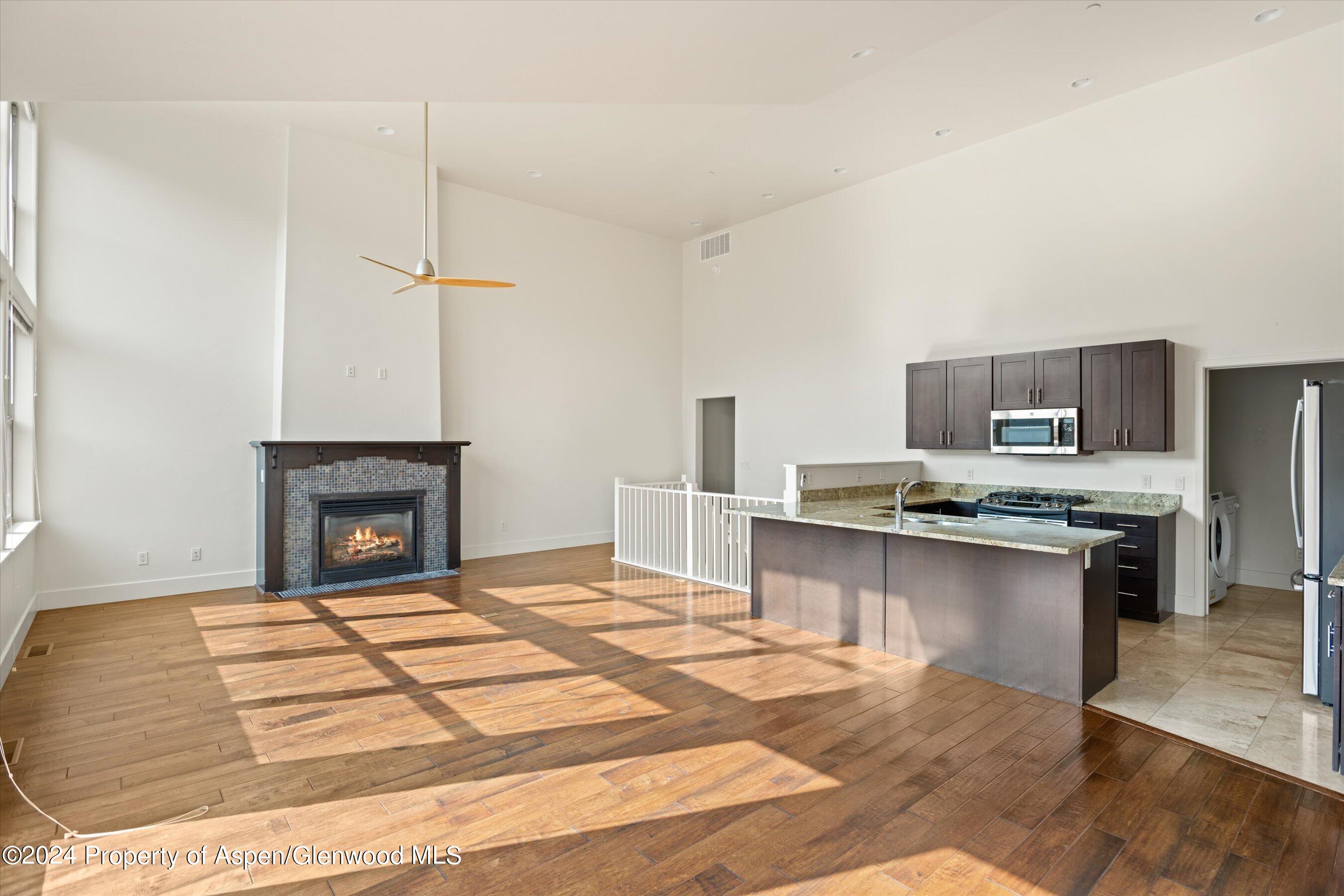 450 Jody Road Basalt, CO 81621 - Photo 5 of 22 a large kitchen with kitchen island a sink stainless steel appliances and cabinets