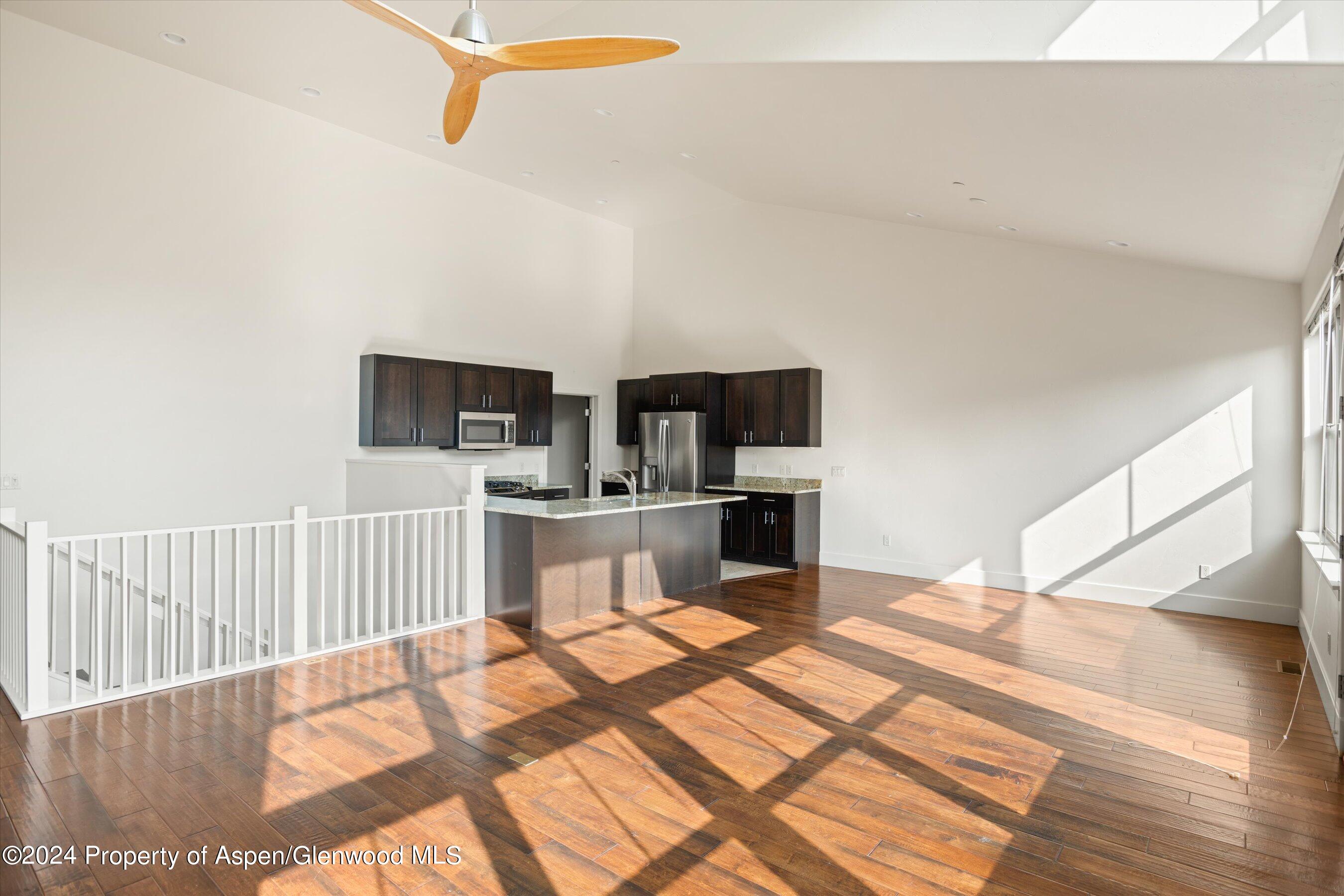 450 Jody Road Basalt, CO 81621 - Photo 9 of 22 a kitchen with stainless steel appliances kitchen island sink refrigerator and stove