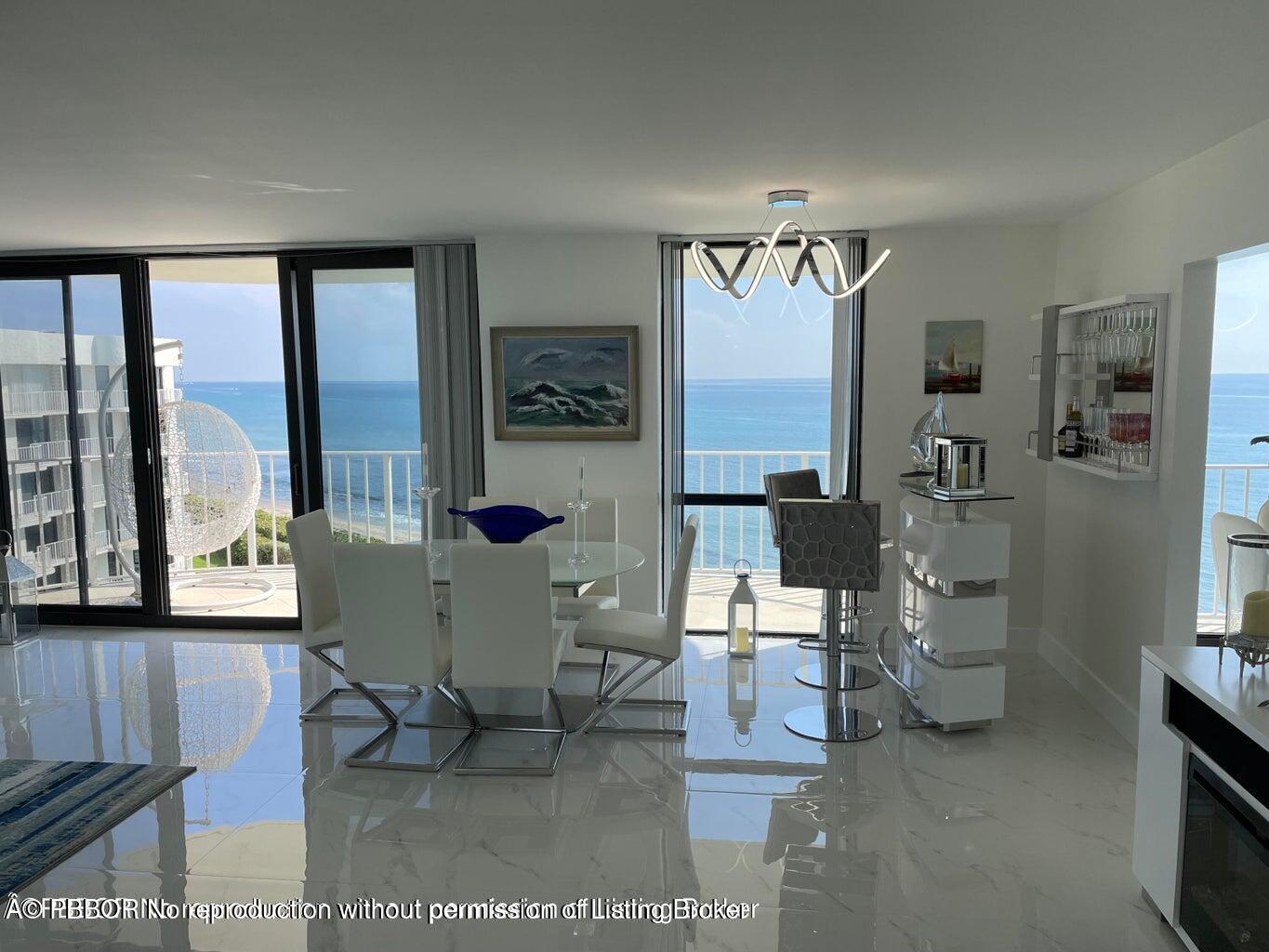 3360 South Ocean Boulevard, Unit 6CII Palm Beach, FL 33480 - Photo 4 of 12 a living room with furniture and large windows