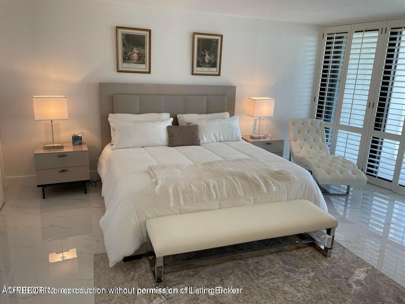 3360 South Ocean Boulevard, Unit 6CII Palm Beach, FL 33480 - Photo 6 of 12 a bedroom with bed and a night stand