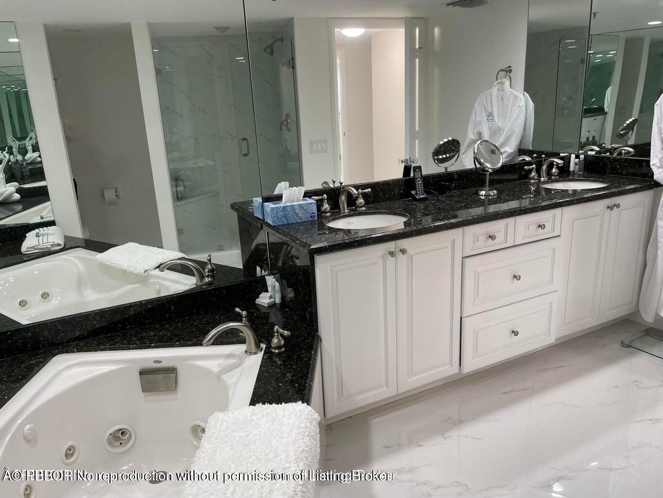 3360 South Ocean Boulevard, Unit 6CII Palm Beach, FL 33480 - Photo 7 of 12 a bathroom with a sink and a mirror