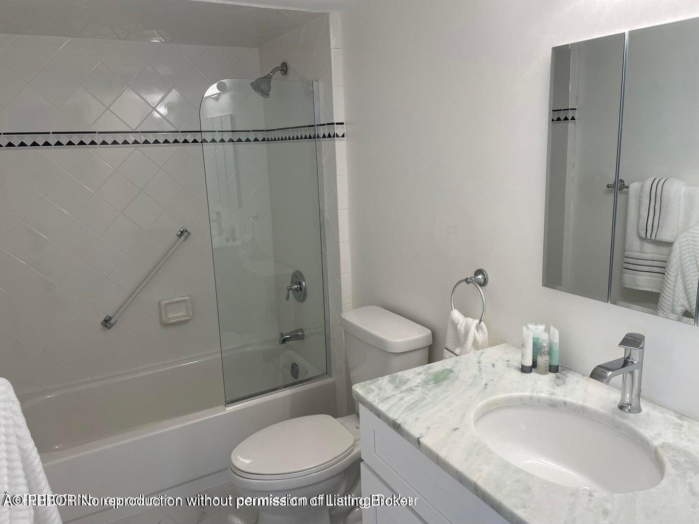 3360 South Ocean Boulevard, Unit 6CII Palm Beach, FL 33480 - Photo 9 of 12 a bathroom with a sink toilet and shower