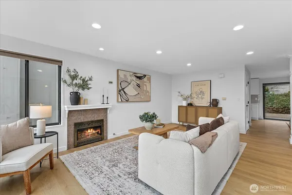 a living room with furniture and a fireplace