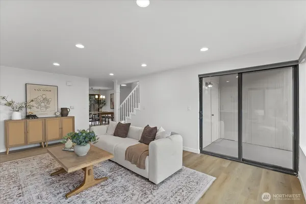 a living room with furniture and a rug