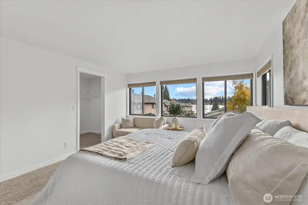 a bedroom with a bed and a couch