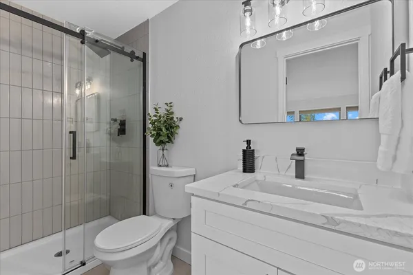 a bathroom with a sink a toilet and a bathtub