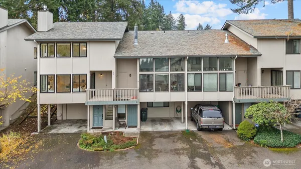 a aerial view of a house with a yard and sitting area
