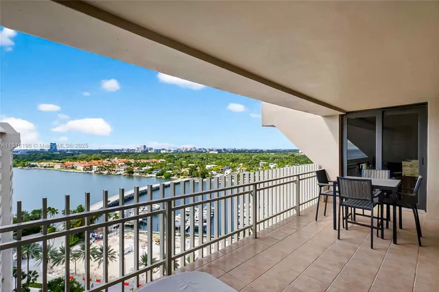 a view of a balcony with furniture
