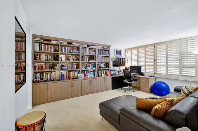 a bathroom with a sink a toilet a mirror and shower