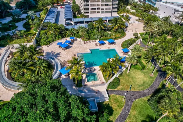 an aerial view of a house with a yard and garden view