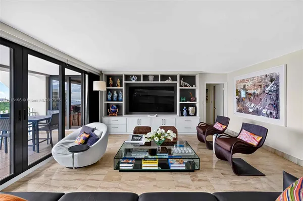 a living room with furniture fireplace and flat screen tv
