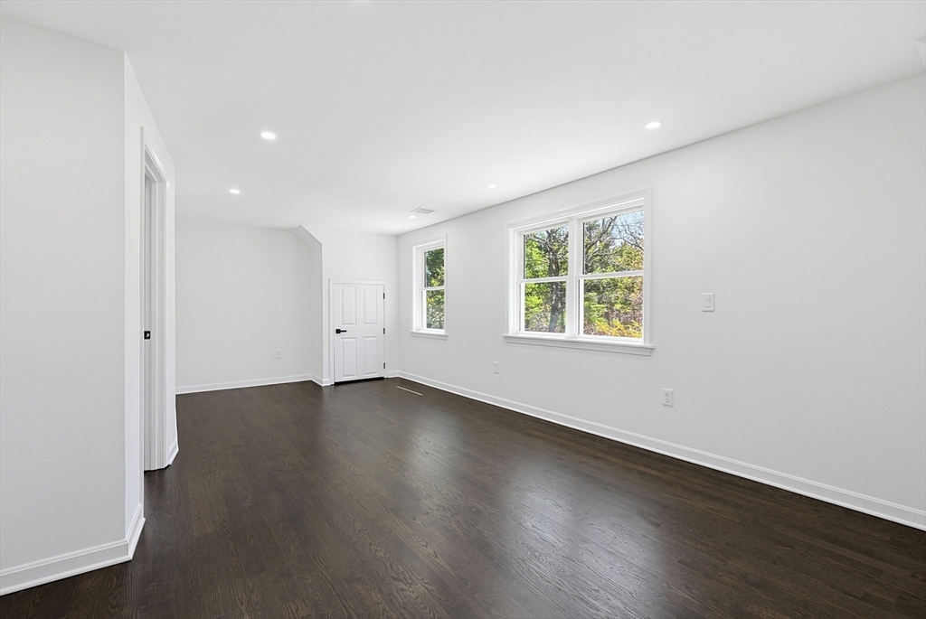175 Pleasant Street Upton, MA 01568 - Photo 19 of 39 an empty room with wooden floor and windows