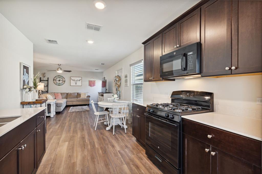 5513 Berea Street Forney, TX 75126 - Photo 28 of 29 Looking from the kitchen into the living room. Great open floor plan!