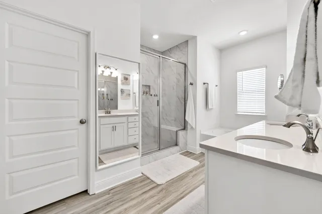 a bathroom with a bathtub and a shower