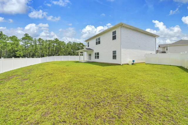 a view of a back yard with green space