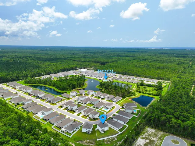 a view of a swimming pool with a yard