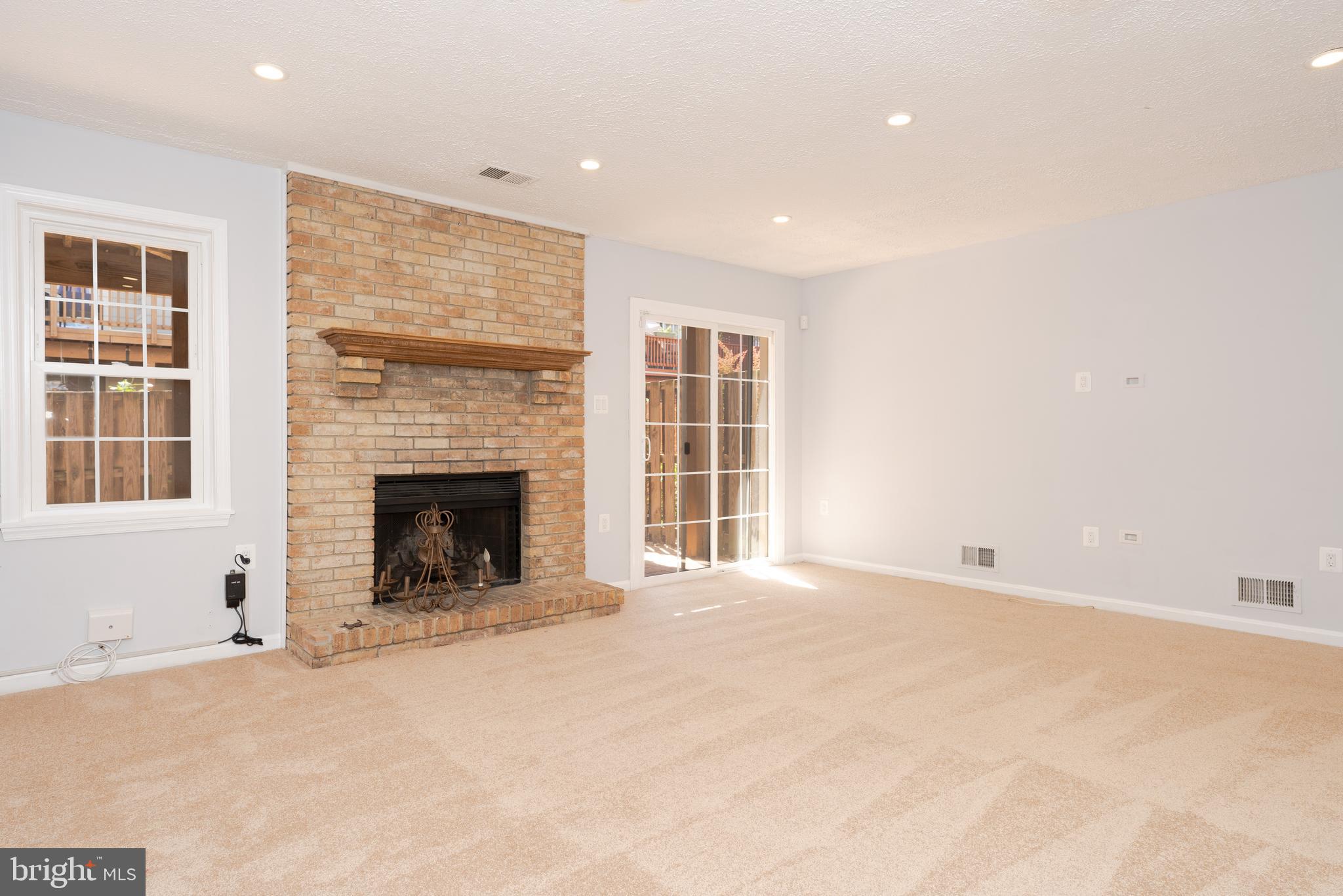 2011 Pieris Court Vienna, VA 22182 - Photo 18 of 39 a view of an empty room with a window and a fireplace