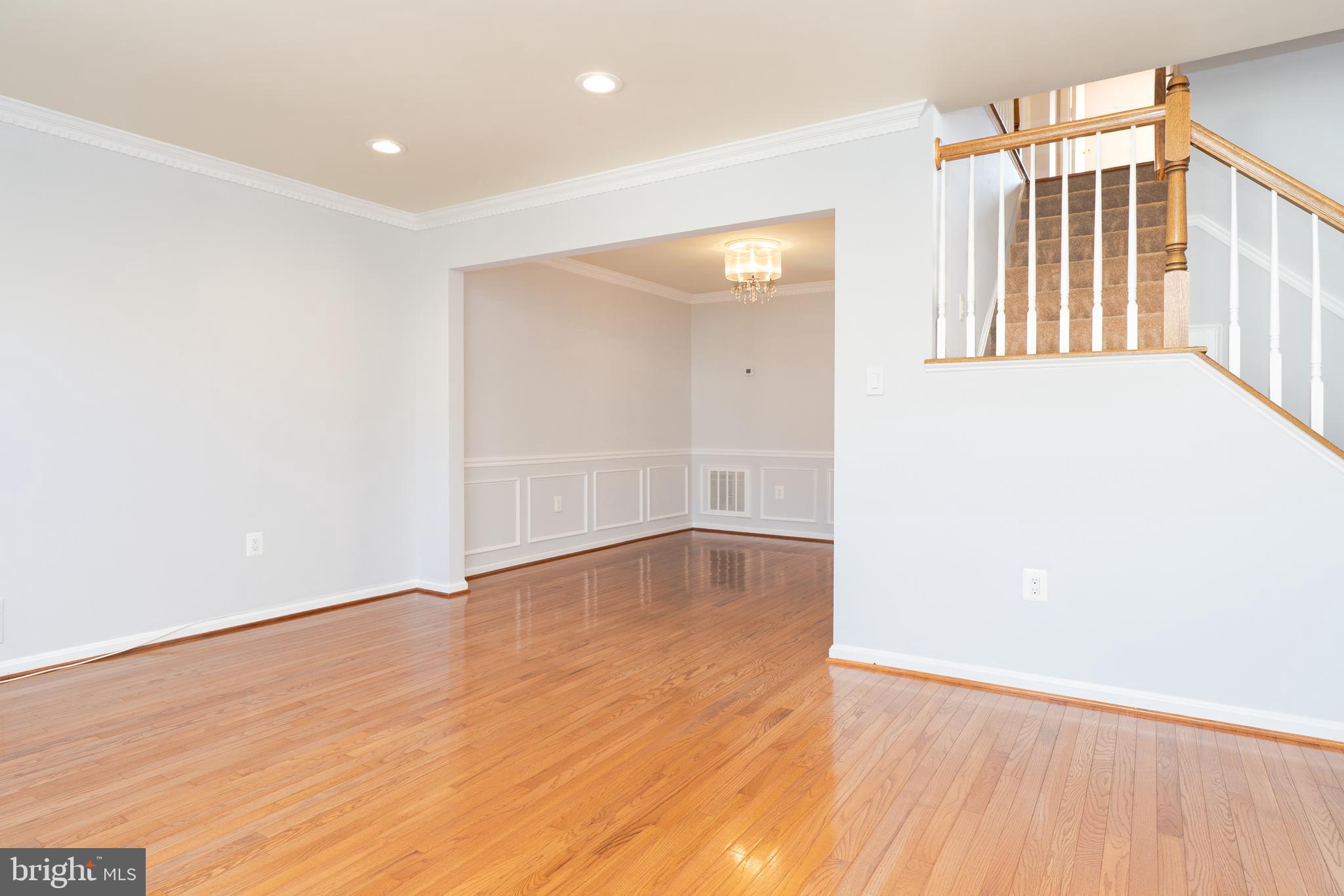 2011 Pieris Court Vienna, VA 22182 - Photo 2 of 39 an empty room with wooden floor and windows