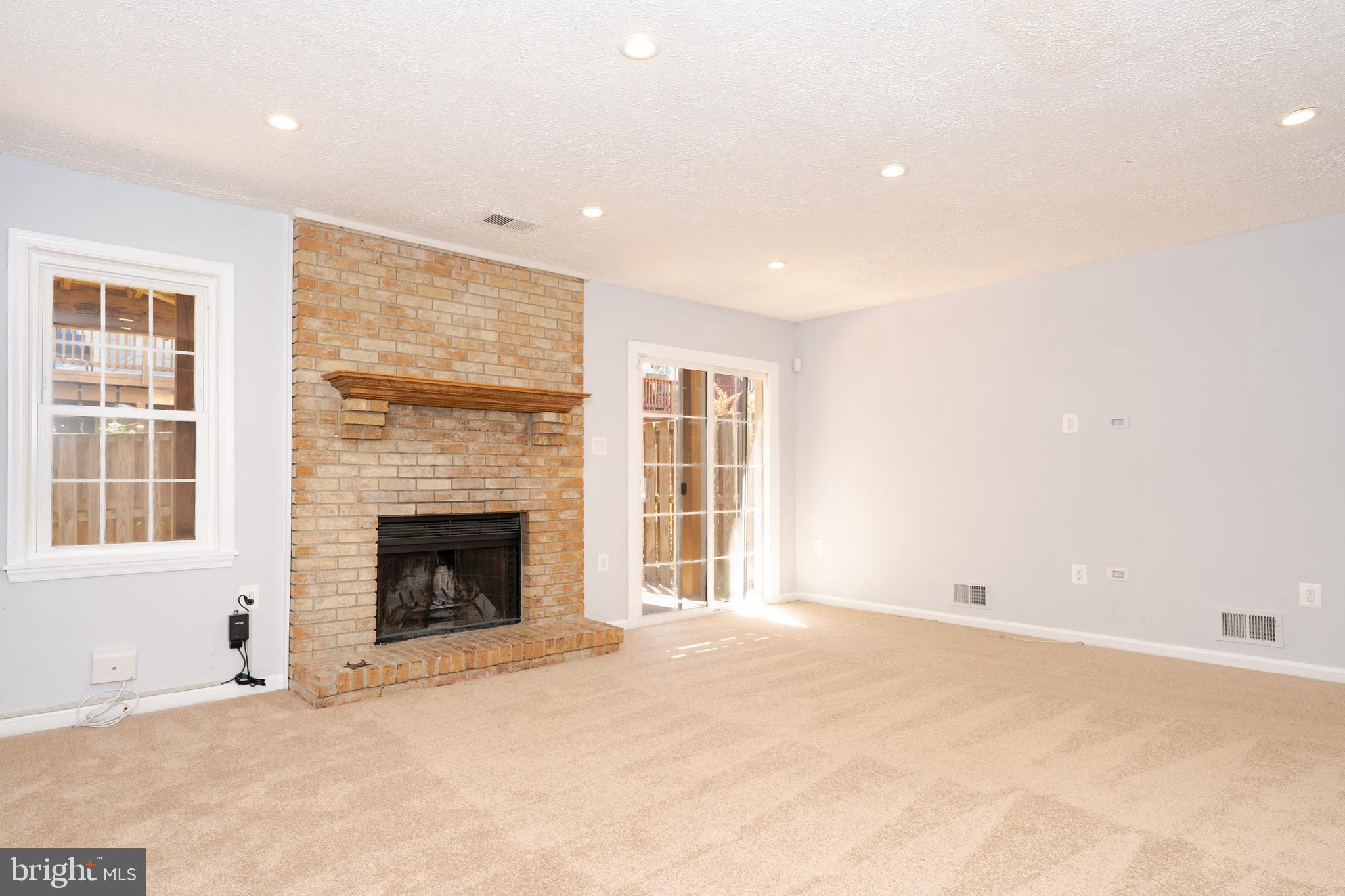 2011 Pieris Court Vienna, VA 22182 - Photo 21 of 39 a view of empty room with a fireplace