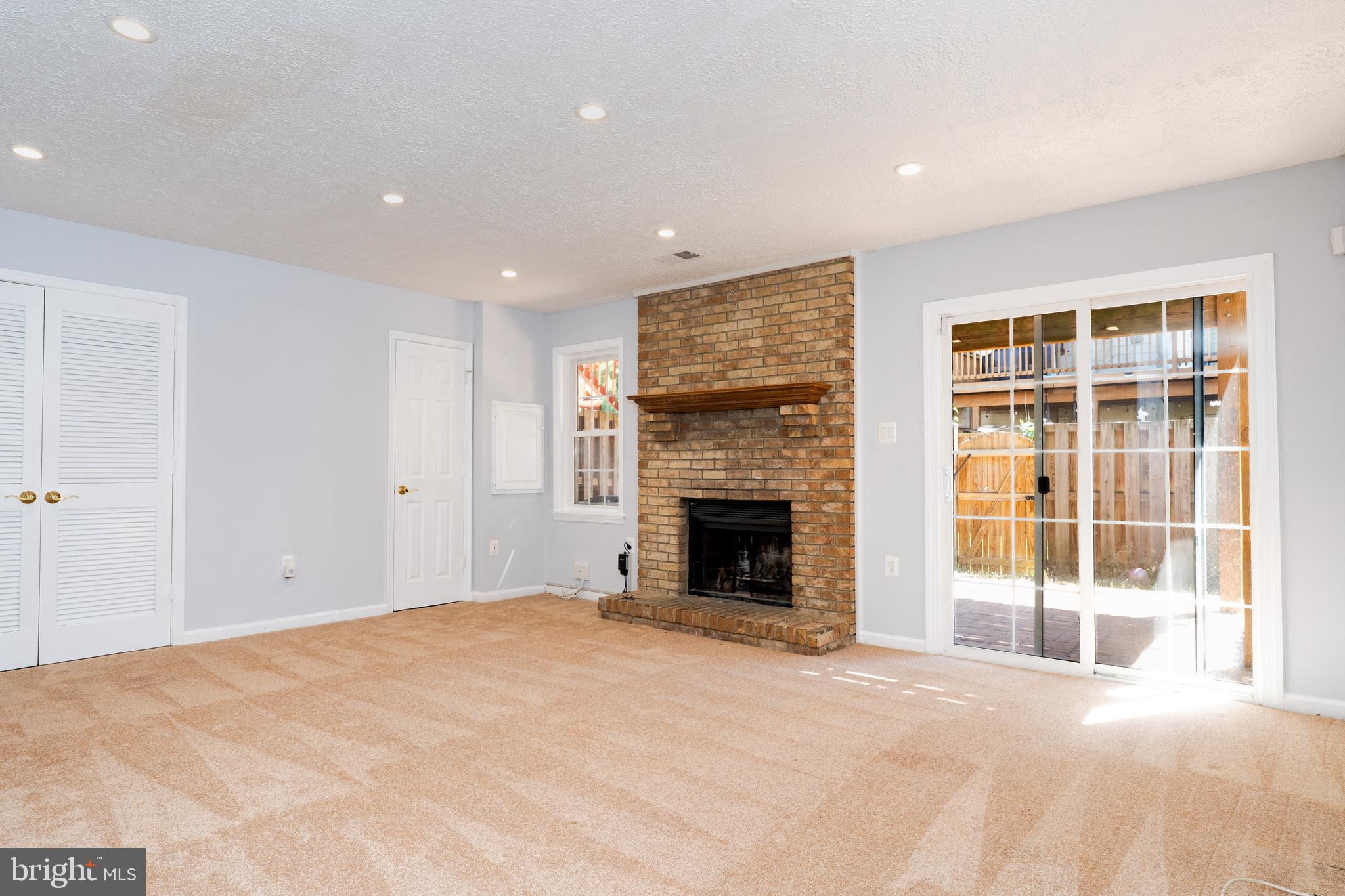 2011 Pieris Court Vienna, VA 22182 - Photo 22 of 39 a view of an empty room with a fireplace and a window