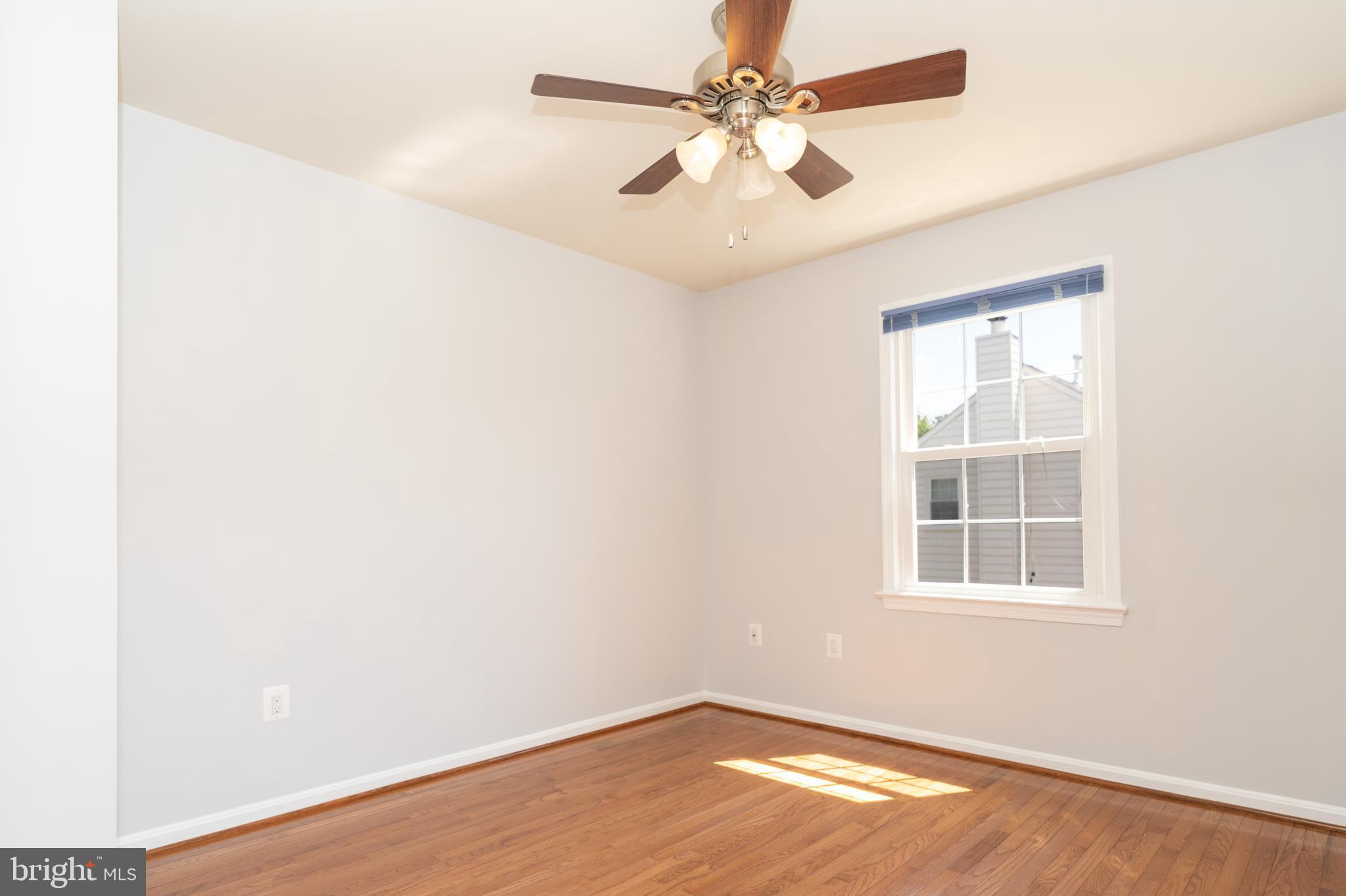 2011 Pieris Court Vienna, VA 22182 - Photo 29 of 39 an empty room with a window and a fan