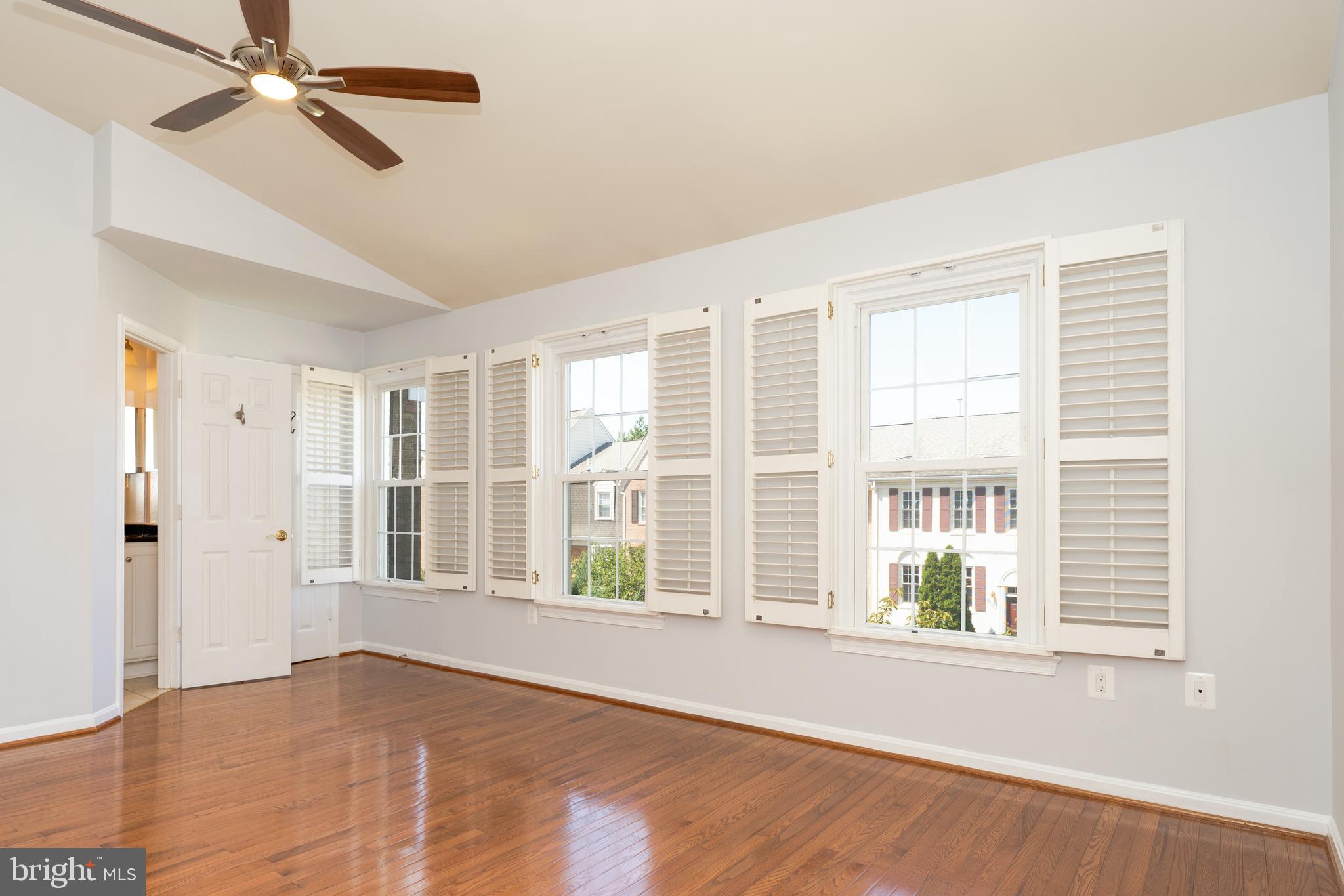 2011 Pieris Court Vienna, VA 22182 - Photo 32 of 39 a view of an empty room with a window and wooden floor