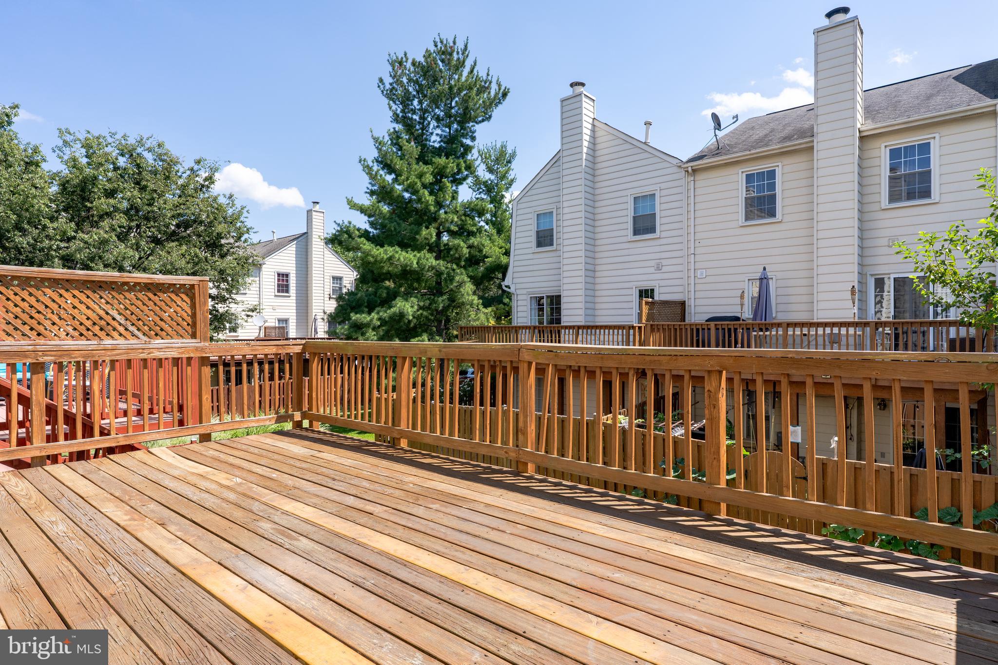 2011 Pieris Court Vienna, VA 22182 - Photo 36 of 39 a view of balcony with wooden floor and fence