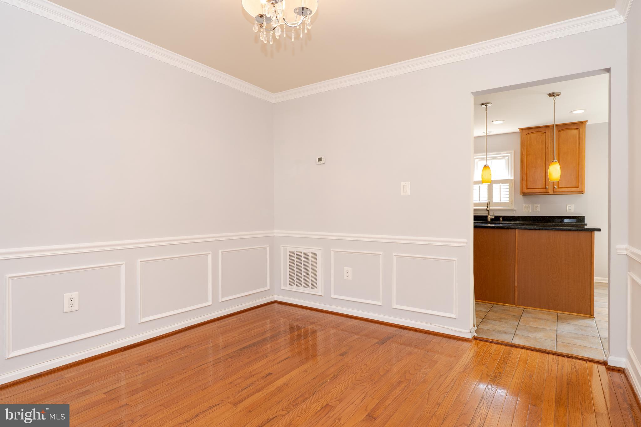 2011 Pieris Court Vienna, VA 22182 - Photo 5 of 39 a view of an empty room with wooden floor
