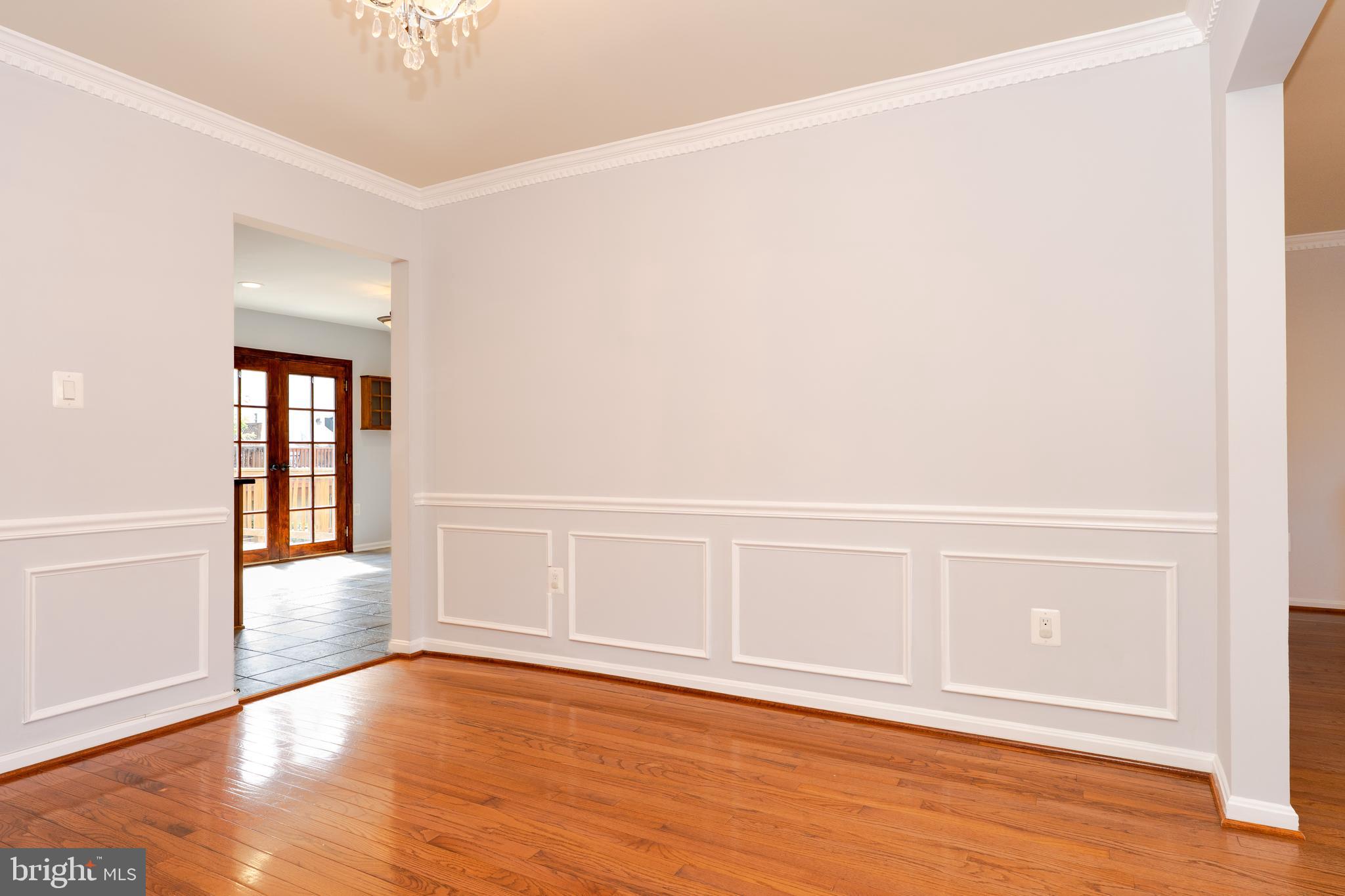2011 Pieris Court Vienna, VA 22182 - Photo 6 of 39 a view of an empty room with wooden floor
