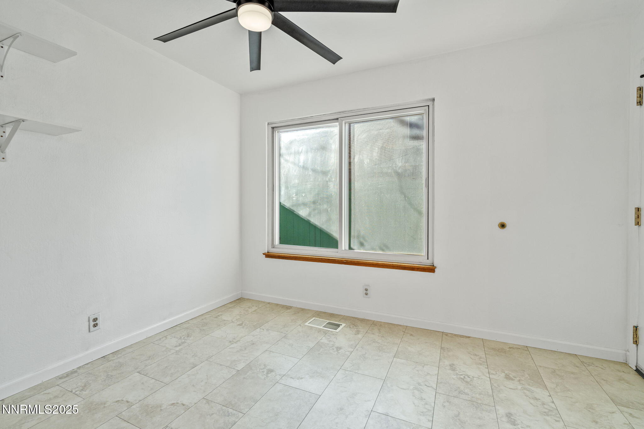1889 Merchant Street Sparks, NV 89431 - Photo 11 of 28 a view of an empty room with a window
