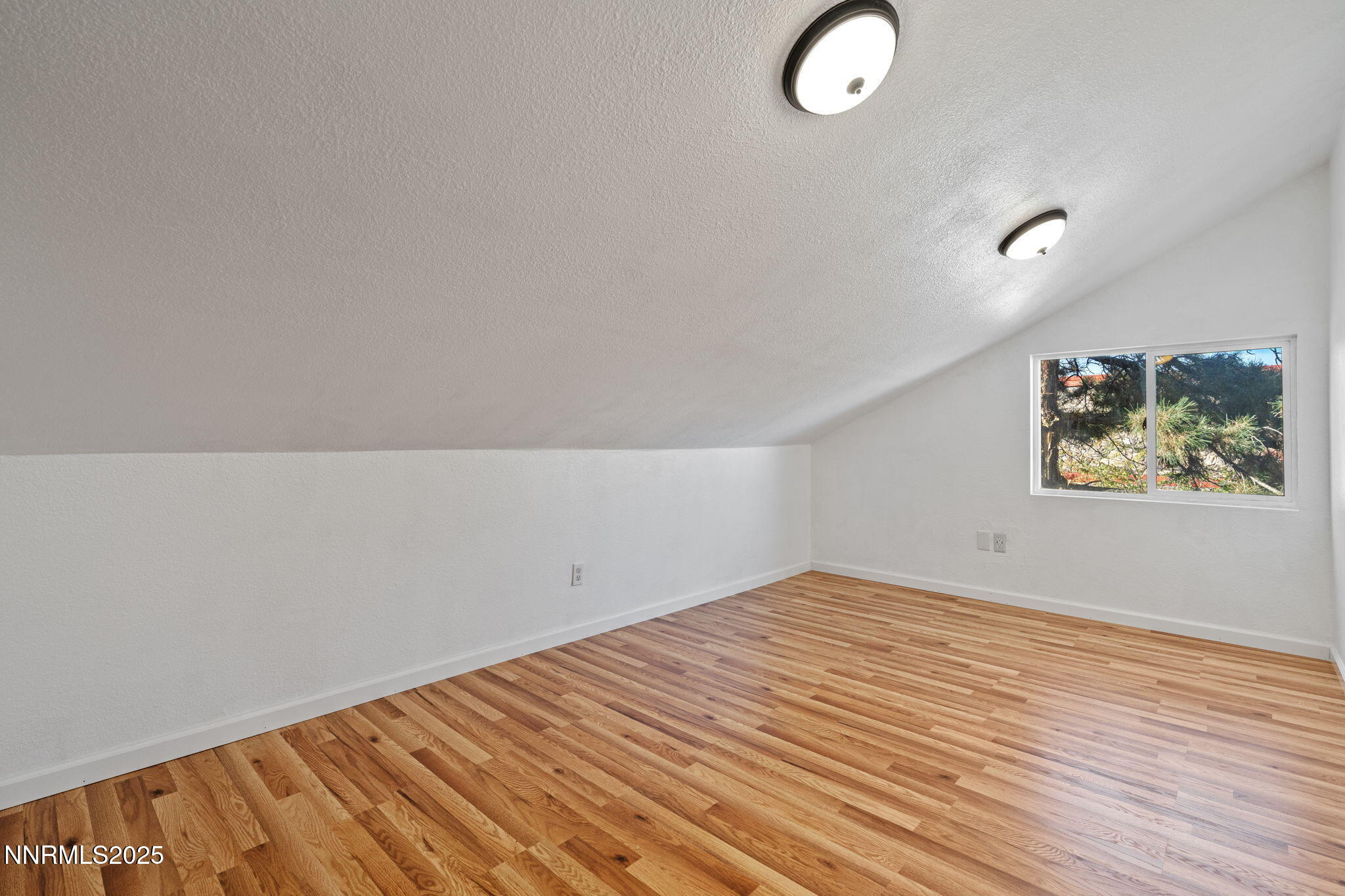 1889 Merchant Street Sparks, NV 89431 - Photo 23 of 28 a view of empty room with wooden floor