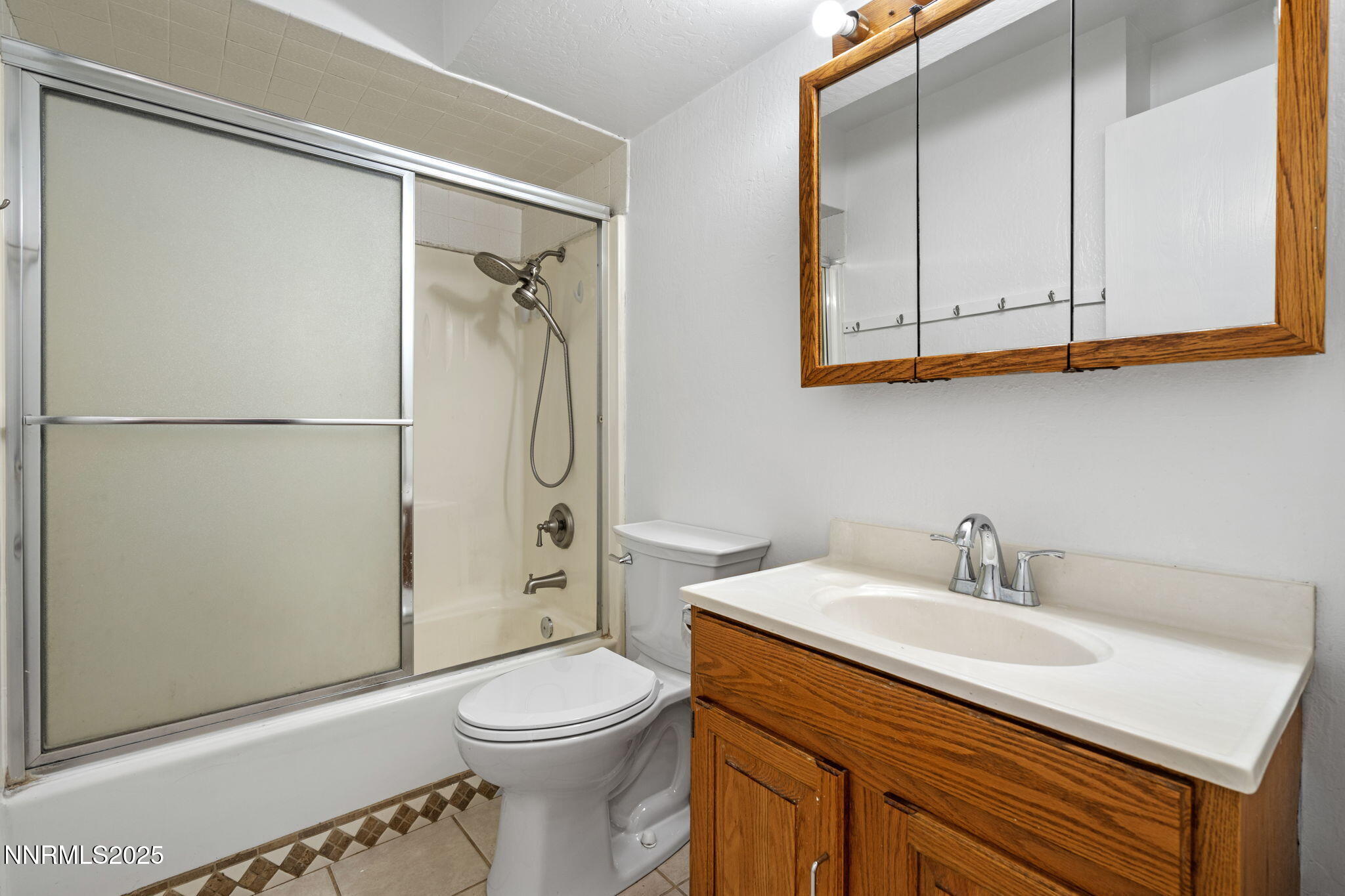 1889 Merchant Street Sparks, NV 89431 - Photo 24 of 28 a bathroom with a sink a toilet and shower