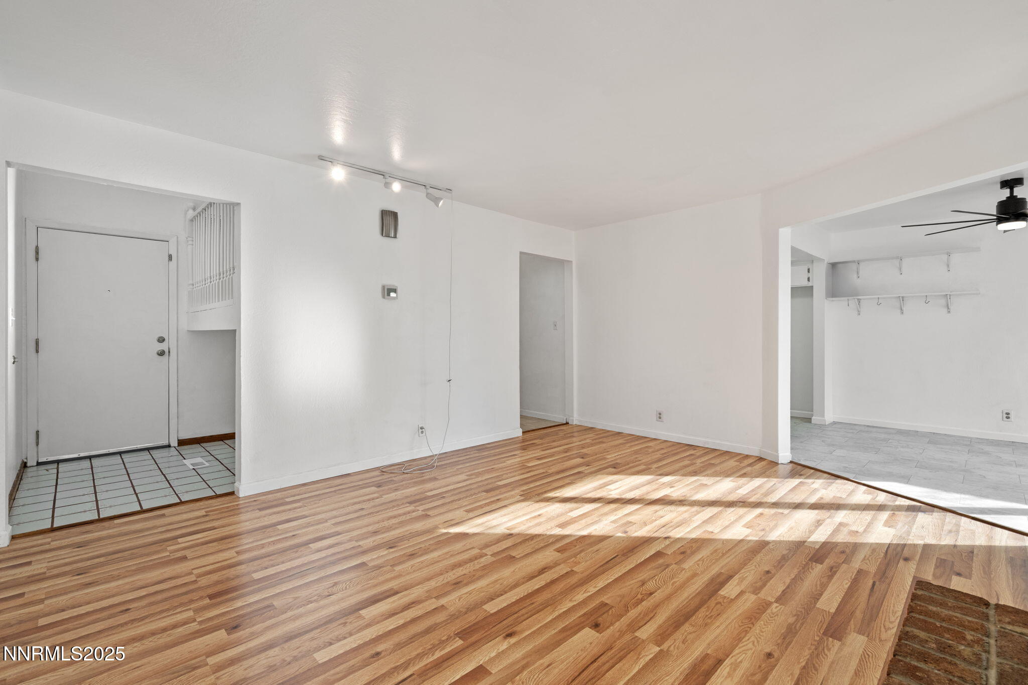 1889 Merchant Street Sparks, NV 89431 - Photo 3 of 28 a view of an empty room and wooden floor