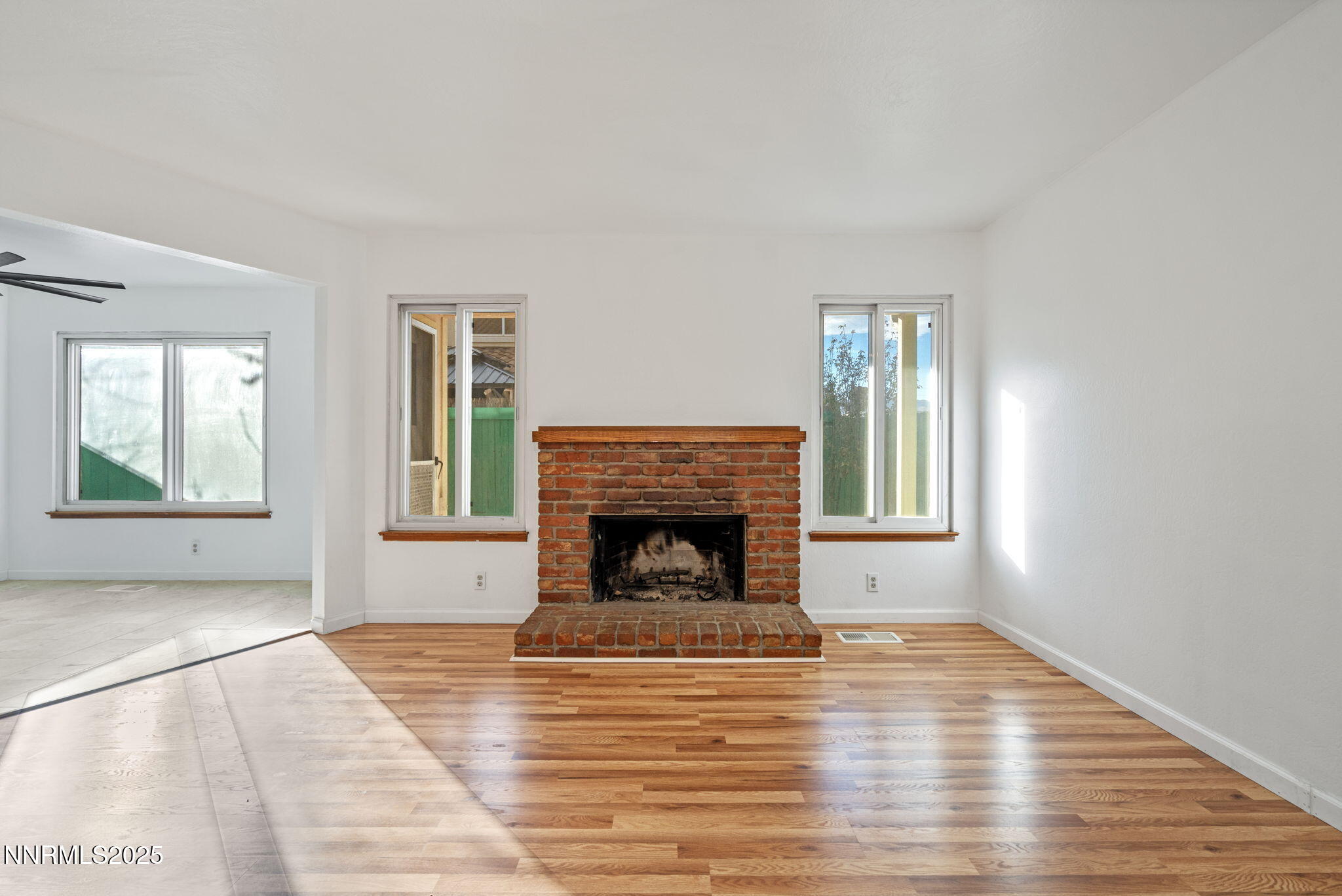 1889 Merchant Street Sparks, NV 89431 - Photo 4 of 28 a view of an empty room with window and fire place