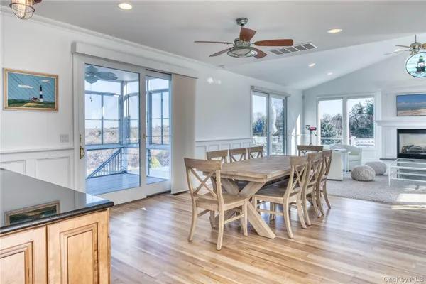 a view of a chairs and table on the wooden floor