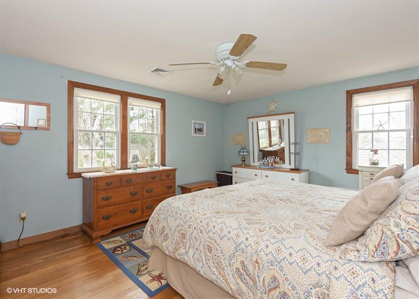 82 Barnacle Road Yarmouth Port, MA 02675 - Photo 8 of 22 a bedroom with a bed and window with wooden floor