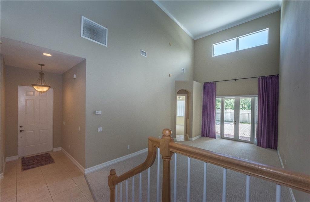 1855 Bridgepointe Circle, Unit 21 Vero Beach, FL 32967 - Photo 12 of 35 a view of hallway with windows