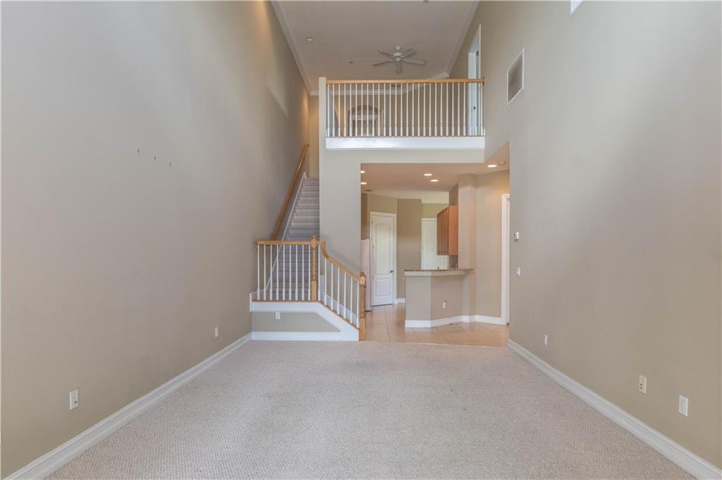 1855 Bridgepointe Circle, Unit 21 Vero Beach, FL 32967 - Photo 13 of 35 a view of a hallway with wooden floor and entryway