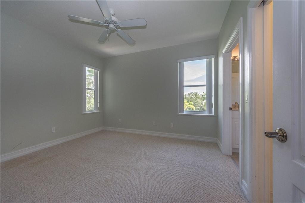 1855 Bridgepointe Circle, Unit 21 Vero Beach, FL 32967 - Photo 19 of 35 a view of an empty room with a window