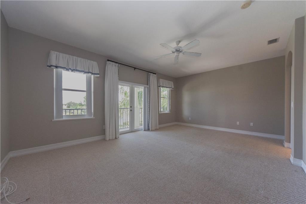 1855 Bridgepointe Circle, Unit 21 Vero Beach, FL 32967 - Photo 22 of 35 a view of an empty room with a window
